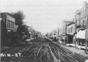 A dirt main street in Alma, Wisconsin around 1900