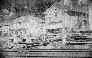 The grain elevator being moved in 1909